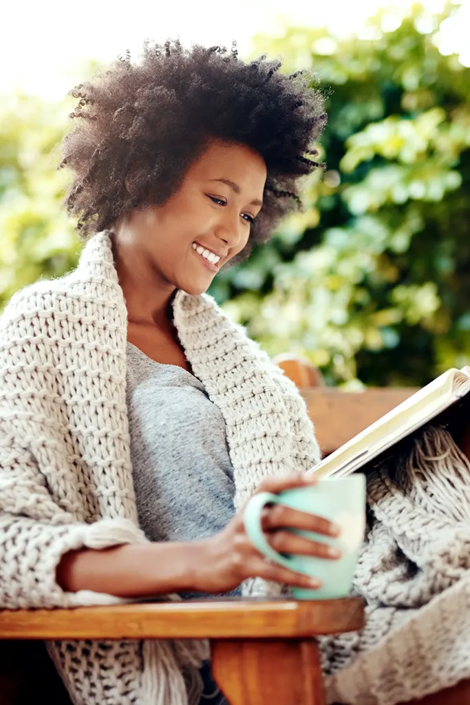 African American woman reading book